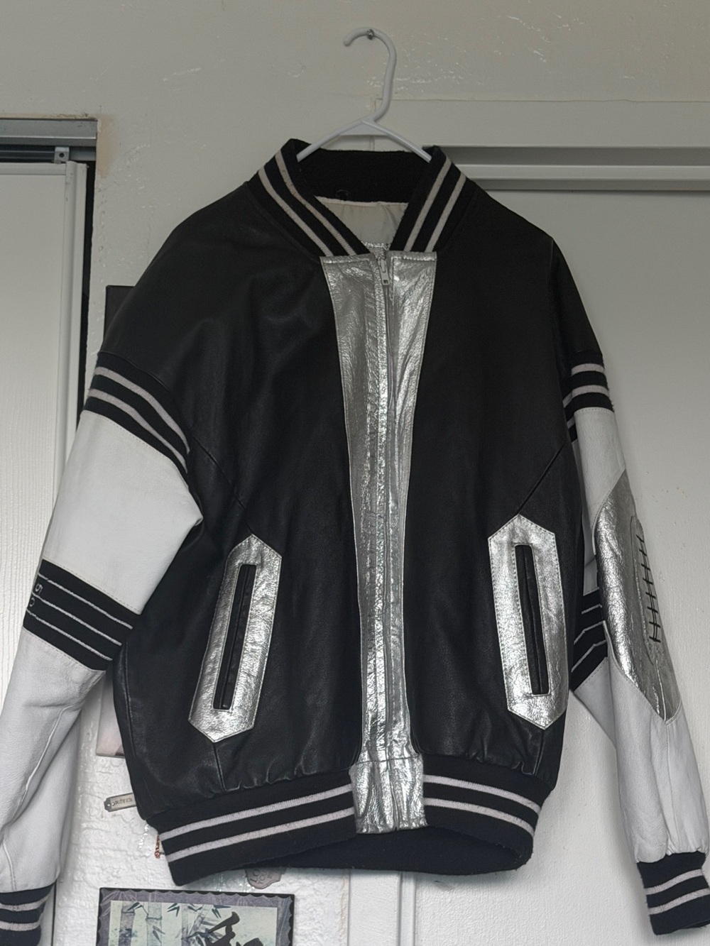 Black and White Leather Bomber Jacket with Silver Accents
